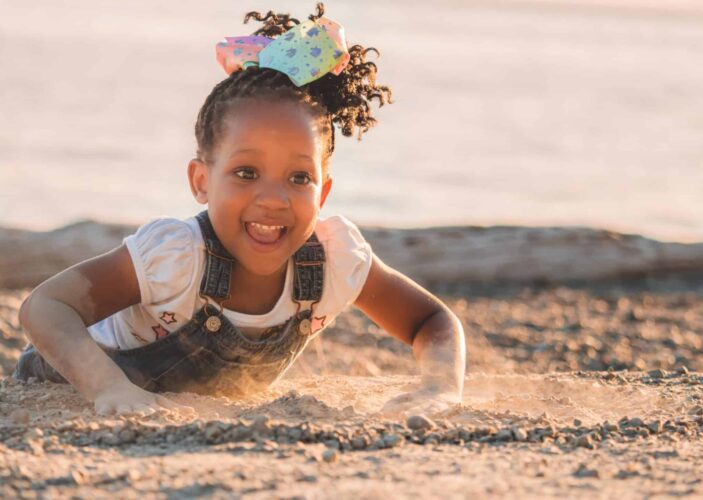 Toddler playing in the sand