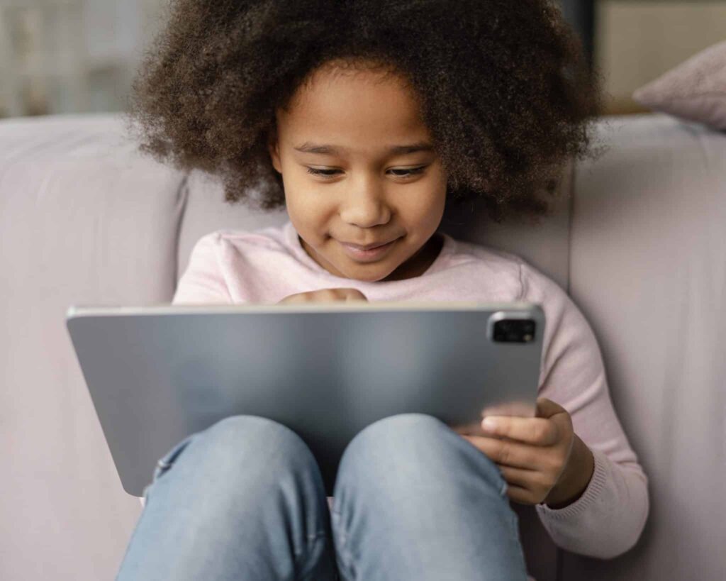 Child playing games on tablet