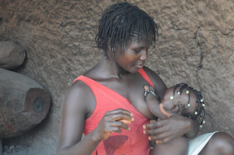 African woman breastfeeding baby